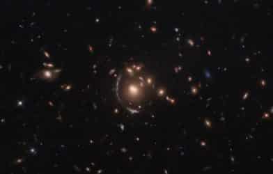 Hubble Space Telescope image of light from a galaxy distorted due to the effects of gravitational lensing.
