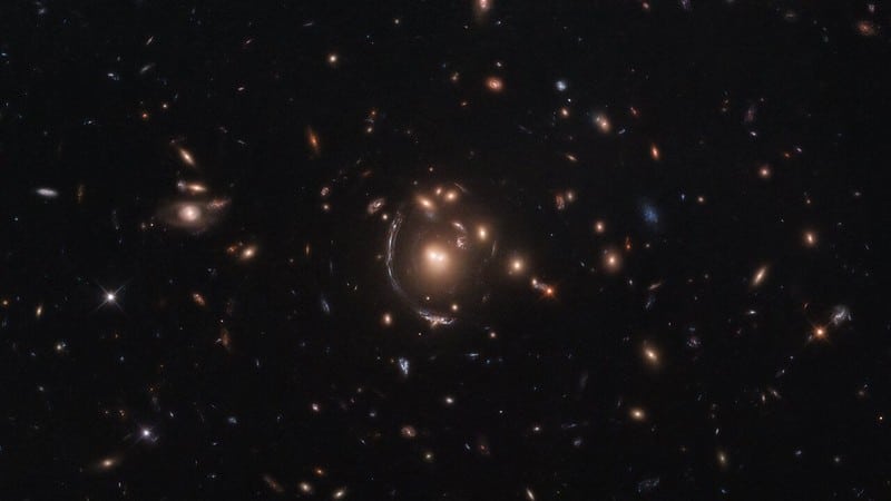 Hubble Space Telescope image of light from a galaxy distorted due to the effects of gravitational lensing.