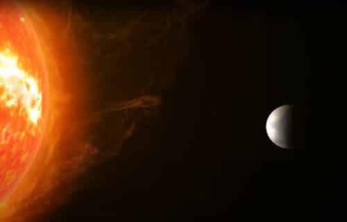 Artistic impression of Super-Earth Gliese 486b and its nearby red dwarf star.