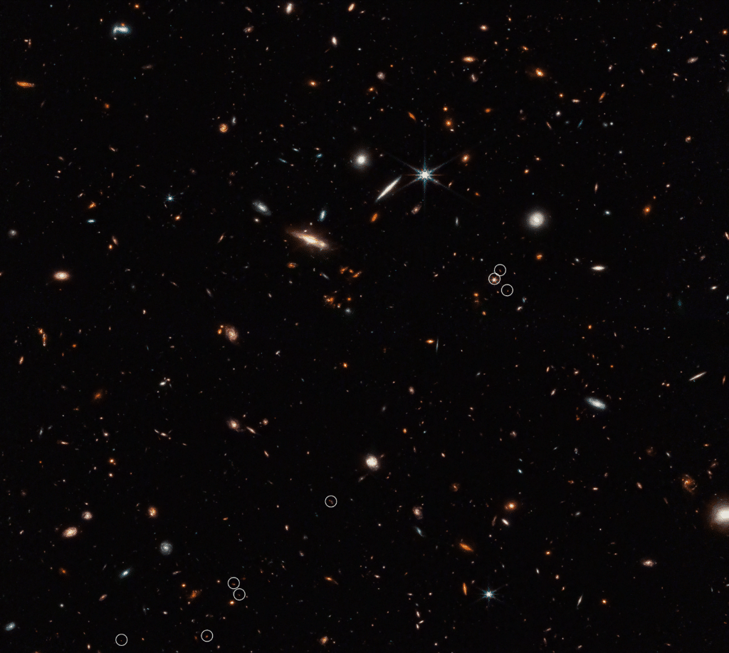 This deep galaxy field from Webb’s NIRCam (Near-Infrared Camera) shows an arrangement of 10 distant galaxies marked by eight white circles in a diagonal, thread-like line.