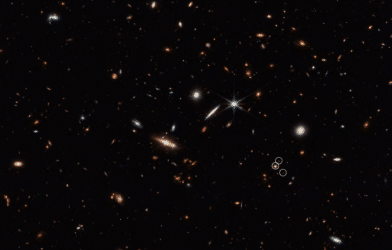 This deep galaxy field from Webb’s NIRCam (Near-Infrared Camera) shows an arrangement of 10 distant galaxies marked by eight white circles in a diagonal, thread-like line.