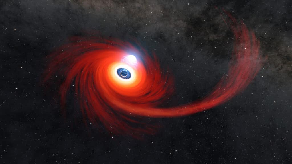 A disk of hot gas swirls around a black hole in this illustration.