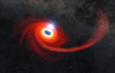 A disk of hot gas swirls around a black hole in this illustration.