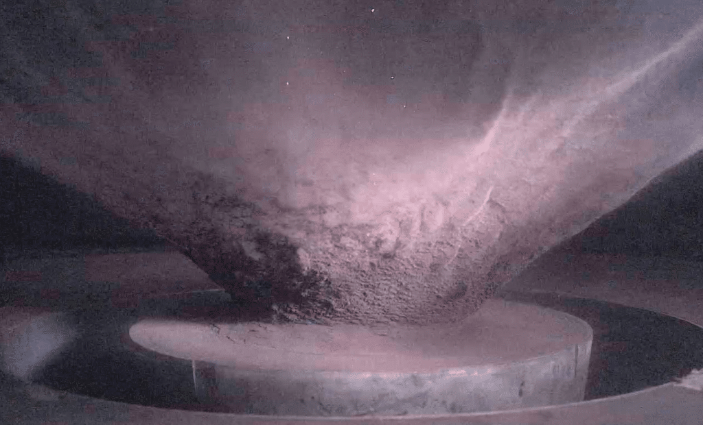 Side view of the ejecta curtain created during a hypervelocity impact experiment at the NASA Ames Vertical Gun Range.