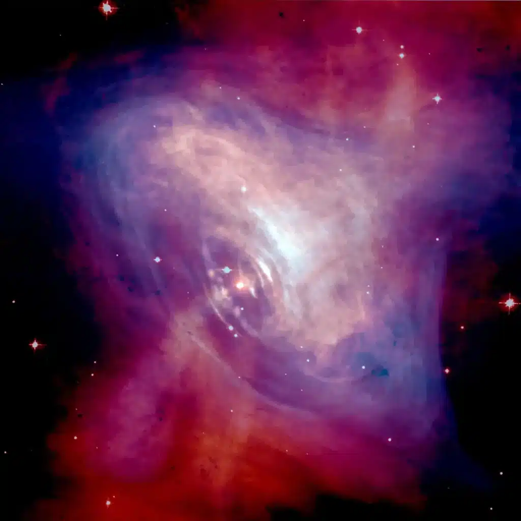 The Crab Nebula – a remnant of a supernova explosion which in its center contains a pulsar. The pulsar makes the ordinary matter in the form of gas in the nebula light up. As the researchers have now shown, it may do the same with dark matter in the form of axions, leading to a subtle additional glow that can be measured.