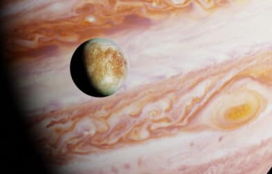 Jupiter's moon Europa in front of the giant planet.
