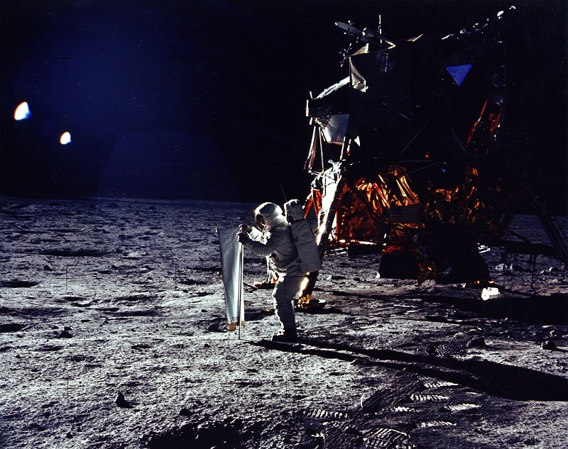 U.S. astronaut Buzz Aldrin erects solar wind experiment on the Moon's surface.