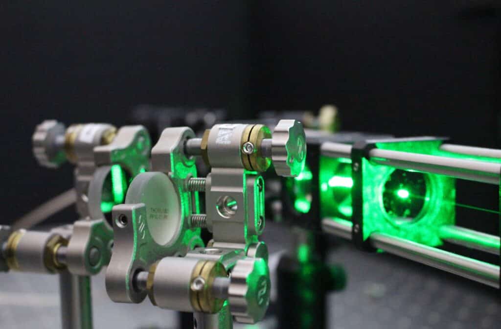 Image shows a laser beam in Gavin Morley’s lab probes the quantum properties of a diamond.
