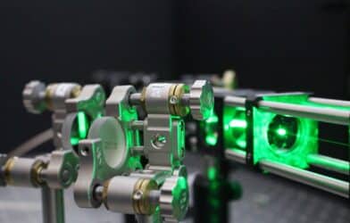 Image shows a laser beam in Gavin Morley’s lab probes the quantum properties of a diamond.