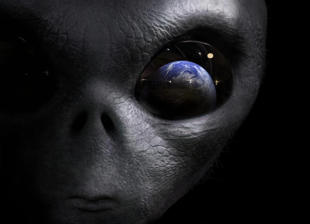 Alien watching Earth, with planet reflecting in its eye