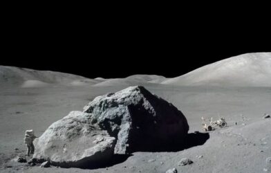 Image shows astronaut-geologist standing next to a huge lunar boulder during NASA’s Apollo 17 mission in 1972
