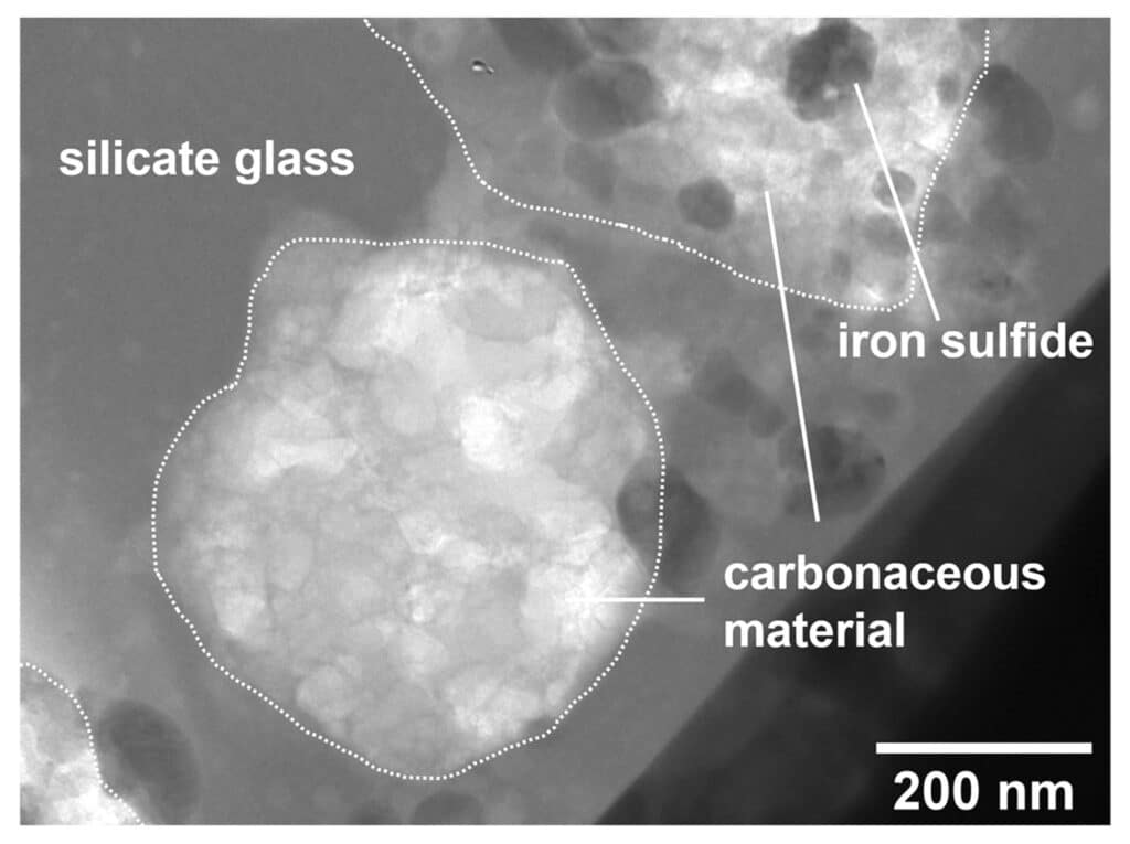 A carbonaceous material found in the melt splash. The carbonaceous material shows spongy texture and contains small iron sulfide inclusions. This is similar to the primitive organic matters found in cometary dust