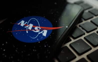 NASA logo on smartphone and keyboard.
