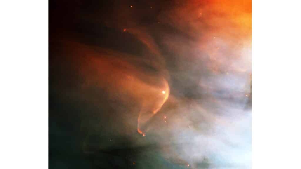 Infrared image of the shockwave (red arc) created by the massive giant star Zeta Ophiuchi in an interstellar dust cloud